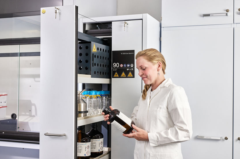 Chemicals are stored in a single cabinet in compliance ...