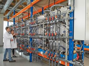 Renewable energy stored in a large-scale battery is introduced into the power grid on demand